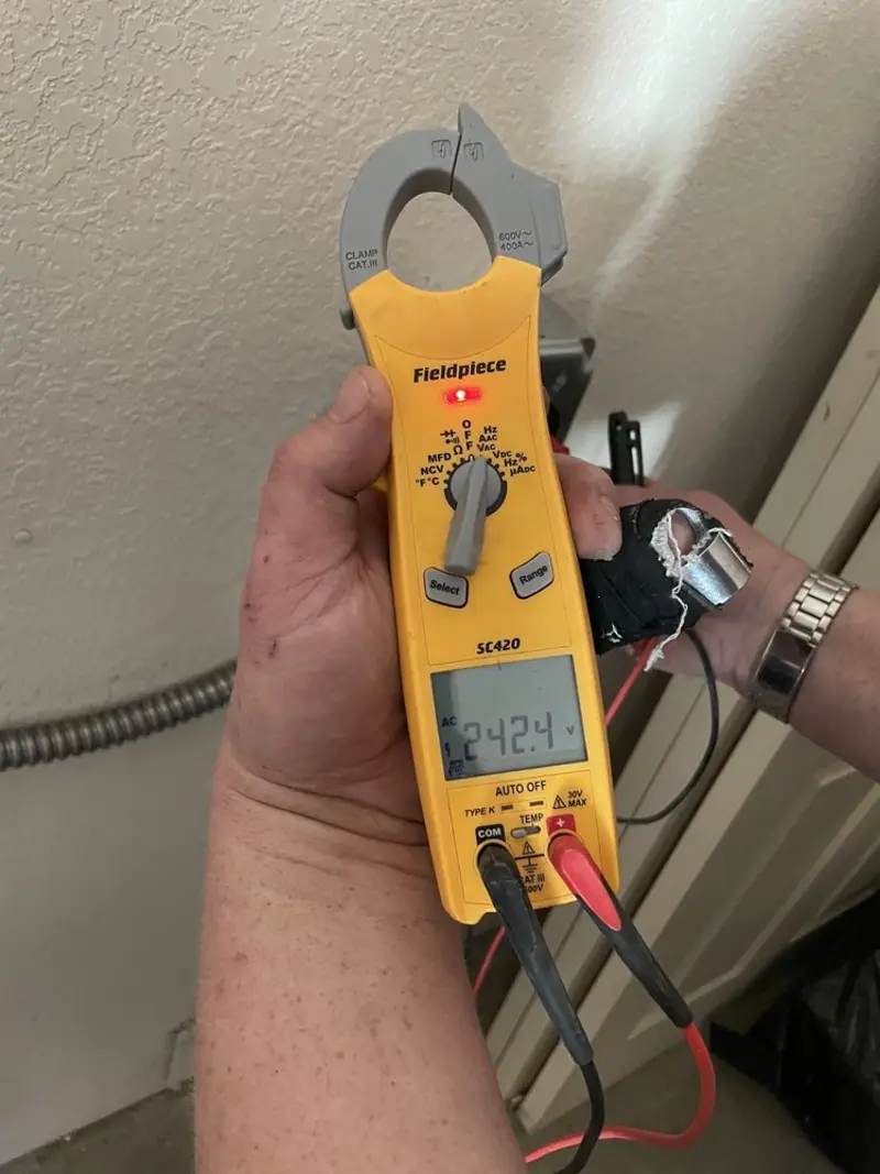 Voltage testing with clamp meter during Ceiling Fan Installation in Fair Oaks Ranch